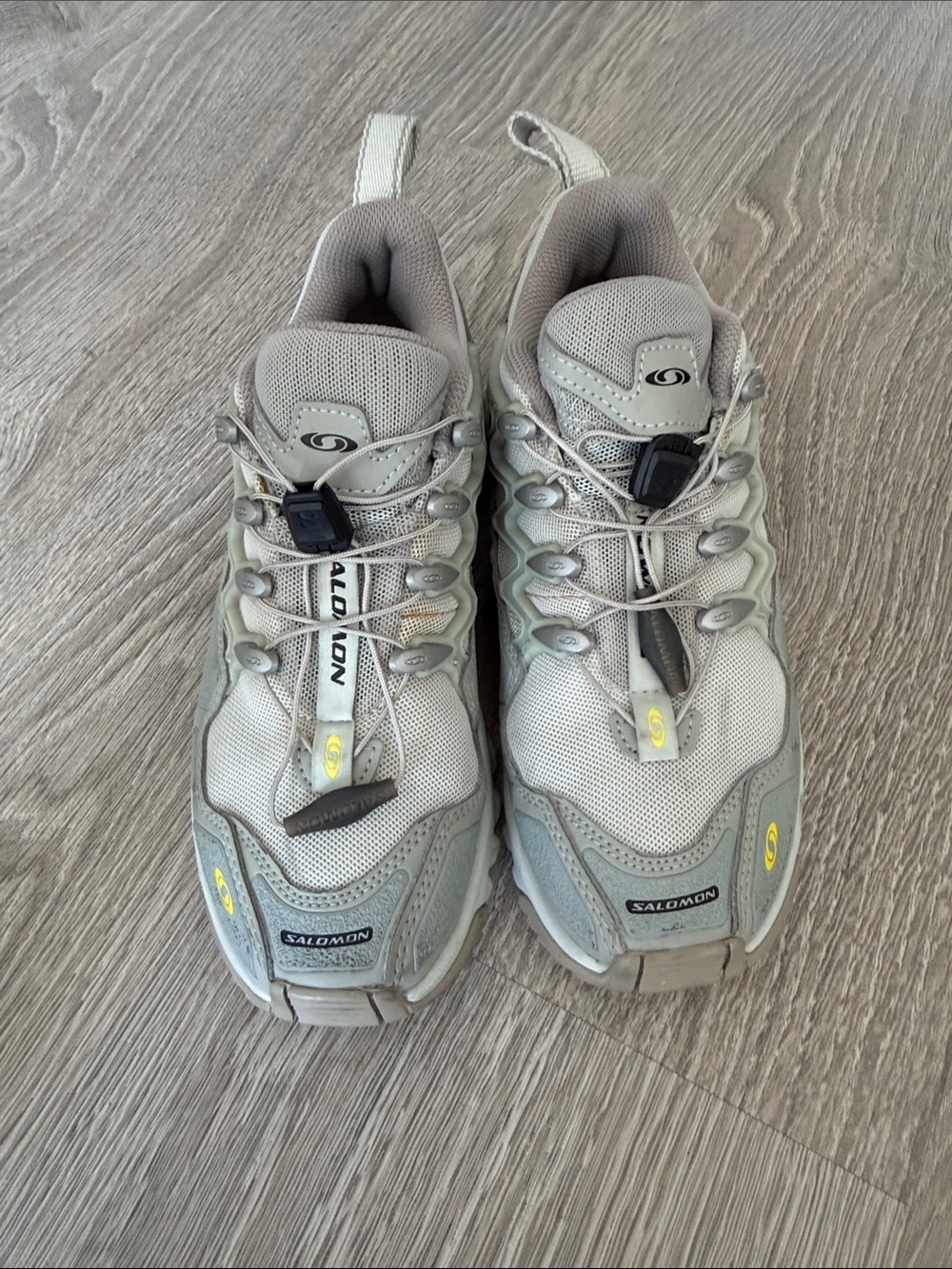 Salomon Trail Running Sneakers in Light Gray with Yellow Accents